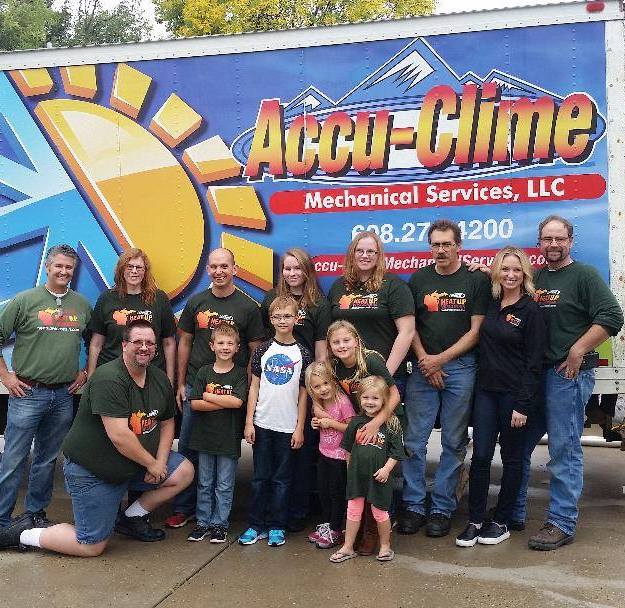 Accu-Clime Team and their spouses and children.